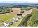 Aerial view showcases a residential area with well-maintained homes, surrounded by dense, green forests at 798 Christian Light Rd, Fuquay Varina, NC 27526