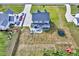 A large yard includes a patio seating area with a fire pit and recreational equipment at 798 Christian Light Rd, Fuquay Varina, NC 27526