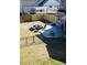 Backyard features a cozy fire pit area, perfect for entertaining, complemented by a lush lawn at 798 Christian Light Rd, Fuquay Varina, NC 27526