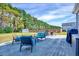 Outdoor patio area, perfect for entertaining, features comfortable chairs, a fire pit, and a lush lawn at 798 Christian Light Rd, Fuquay Varina, NC 27526