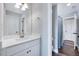 Bright bathroom featuring a modern vanity with a white countertop and decorative mirror at 798 Christian Light Rd, Fuquay Varina, NC 27526