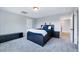 Spacious carpeted bedroom with natural light and black furniture set at 798 Christian Light Rd, Fuquay Varina, NC 27526