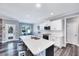 Spacious kitchen with white cabinets, quartz countertops, and island at 798 Christian Light Rd, Fuquay Varina, NC 27526
