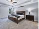 Carpeted primary bedroom with ceiling fan, tray ceilings, shiplap accent wall and natural light at 798 Christian Light Rd, Fuquay Varina, NC 27526