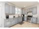 Modern kitchen featuring stainless steel appliances and granite countertops at 8010 Mackenzie Ct, Durham, NC 27713