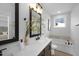 Modern bathroom with double vanity, soaking tub, and walk-in shower at 917 Myers Point Dr # 21, Morrisville, NC 27560