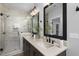 Spa-like bathroom featuring double sinks, walk-in shower, and modern fixtures at 917 Myers Point Dr # 21, Morrisville, NC 27560