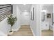 Clean hallway with white bathroom and modern vanity at 917 Myers Point Dr # 21, Morrisville, NC 27560
