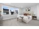 Spacious bedroom with large windows and a comfortable bed at 917 Myers Point Dr # 21, Morrisville, NC 27560
