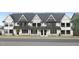Three townhouses with white siding, gray trim, and metal roofs at 917 Myers Point Dr # 21, Morrisville, NC 27560