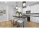 Modern kitchen with gray island and white cabinets at 917 Myers Point Dr # 21, Morrisville, NC 27560