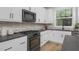 Modern kitchen with white cabinets and dark countertops at 917 Myers Point Dr # 21, Morrisville, NC 27560