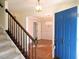 Bright entryway with hardwood floors, staircase, and a view to the dining room at 1 Danforth Pl, Durham, NC 27712