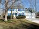 Two-story home with blue shutters, double garage, and well-maintained lawn at 1 Danforth Pl, Durham, NC 27712