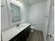 Beautiful bathroom features a modern vanity with a white countertop and dark brown cabinets at 100 Preacher Ln, Angier, NC 27501