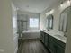 An elegant bathroom features a separate shower, soaker tub, and double vanity sinks at 100 Preacher Ln, Angier, NC 27501