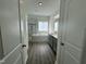 An elegant bathroom features a separate shower, soaker tub, and attractive vanity at 100 Preacher Ln, Angier, NC 27501