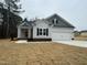 Charming single-Gathering home with a two-car garage, landscaped lawn and a welcoming front porch at 100 Preacher Ln, Angier, NC 27501