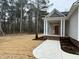 Red front door, brick steps, and covered porch with columns at 100 Preacher Ln, Angier, NC 27501