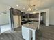 Kitchen features granite countertops, dark wood cabinets, a central island, and pendant lighting at 100 Preacher Ln, Angier, NC 27501