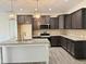 Modern kitchen with granite countertops, stainless steel appliances, and a central island at 100 Preacher Ln, Angier, NC 27501