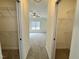 A main bedroom with walk-in closets, a large window and a ceiling fan at 100 Preacher Ln, Angier, NC 27501