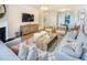 Spacious living room with hardwood floors and a modern fireplace at 1011 Freestone Rd, Durham, NC 27703