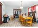 Dining room with wood table and chairs, view of living room at 1026 Nashville Rd, Rocky Mount, NC 27803