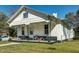 White house with a covered porch, offering curb appeal at 1026 Nashville Rd, Rocky Mount, NC 27803