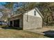 Detached block garage with double wooden doors at 1026 Nashville Rd, Rocky Mount, NC 27803