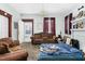 Spacious living room featuring a brown couch and hardwood floors at 1026 Nashville Rd, Rocky Mount, NC 27803