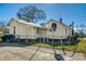 Rear view of the house with a fenced yard at 1026 Nashville Rd, Rocky Mount, NC 27803