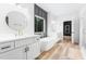 Bright bathroom features a soaking tub, double vanity, and gold fixtures at 1040 Southern High School Rd, Burlington, NC 27215