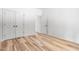 Bright bedroom features hardwood floors, white doors, and lots of natural light at 1040 Southern High School Rd, Burlington, NC 27215