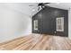 Spacious bedroom with vaulted ceilings, two windows, and a dark accent wall with decorative molding at 1040 Southern High School Rd, Burlington, NC 27215
