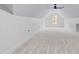 Bright bonus room features vaulted ceilings, neutral carpeting, and a window letting in natural light at 1040 Southern High School Rd, Burlington, NC 27215