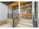 Inviting double front door with glass panes and stone accents on exterior at 1040 Southern High School Rd, Burlington, NC 27215