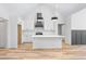 Bright, modern kitchen with white cabinets, subway tile backsplash, and spacious island at 1040 Southern High School Rd, Burlington, NC 27215