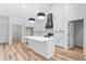 Bright kitchen features white cabinets, modern appliances, an island, and stylish pendant lighting at 1040 Southern High School Rd, Burlington, NC 27215