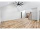 Expansive living room with a high ceiling, wooden staircase and contemporary ceiling fan at 1040 Southern High School Rd, Burlington, NC 27215