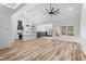 Open-concept living space with high ceilings, wood floors, and an abundance of natural light at 1040 Southern High School Rd, Burlington, NC 27215