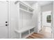 Welcoming mudroom features built-in storage, a bench, and easy access to the outdoors at 1040 Southern High School Rd, Burlington, NC 27215