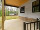 Covered back patio with wood ceiling and a view of the backyard at 1040 Southern High School Rd, Burlington, NC 27215