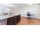 Island with sink and seating area in spacious kitchen at 10510 Sablewood Dr # 110, Raleigh, NC 27617