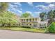 Charming two-story home with balcony, black shutters, and a lush front lawn at 110 E Orange St, Hillsborough, NC 27278