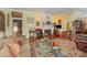 Cozy living room boasts a fireplace, hardwood floors, and an ornate oriental rug at 110 E Orange St, Hillsborough, NC 27278