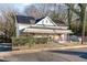 House exterior with solar panels, porch, and chain link fence at 1105 Carroll St, Durham, NC 27707