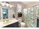 This bathroom features an updated vanity and shower with updated lighting fixtures at 112 Smith Rock Dr, Holly Springs, NC 27540