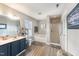 Modern bathroom with double vanity, soaking tub, and separate glass shower with neutral grey walls at 112 Smith Rock Dr, Holly Springs, NC 27540