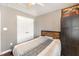 Comfortable bedroom with closet, wood-look flooring, and natural light at 112 Smith Rock Dr, Holly Springs, NC 27540